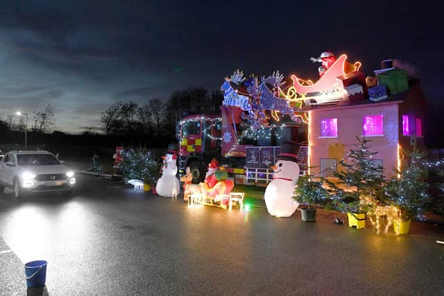 Santa's drive-through grotto at Sleaford fire station, for Firefighters Charity. EMN-201217-180038001