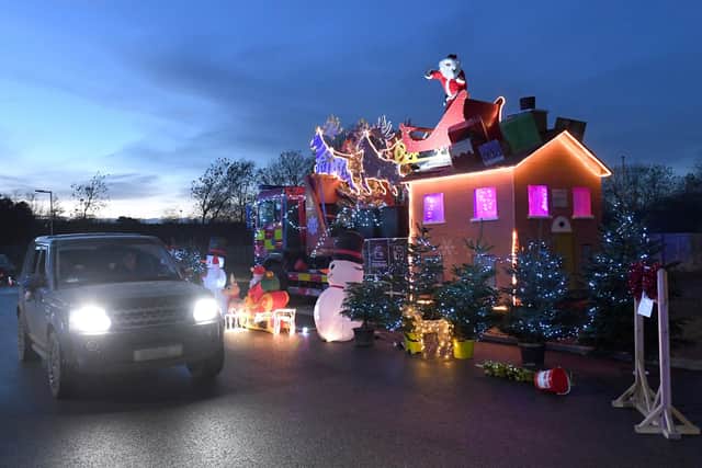 Santa's drive-through grotto at Sleaford fire station, for Firefighters Charity. EMN-201217-180135001