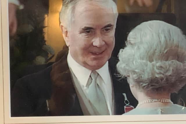 Peter receives his OBE from the Queen