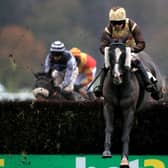 MARKET RASEN, ENGLAND - DECEMBER 03: Zakety Zak ridden by Sean Quinlan (centre) clears a fence during the Watch & Bet At MansionBet Handicap Chase at Market Rasen Racecourse on December 3, 2020 in Market Rasen, England. (Photo by Mike Egerton - Pool/Getty Images) 775593760