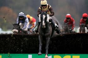 MARKET RASEN, ENGLAND - DECEMBER 03: Zakety Zak ridden by Sean Quinlan (centre) clears a fence during the Watch & Bet At MansionBet Handicap Chase at Market Rasen Racecourse on December 3, 2020 in Market Rasen, England. (Photo by Mike Egerton - Pool/Getty Images) 775593760
