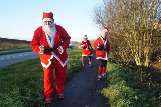 Claire Semple, Sharon Bothamley and Amanda Curtis on their Santa Run EMN-201222-080309001