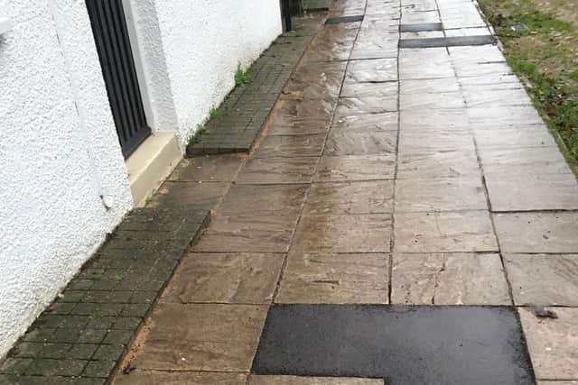 The paving slabs which need to be replaced.
