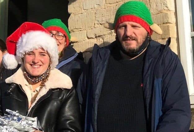Adrian Ruby and Sally Johnson help deliver Christmas meals. EMN-201224-130708001