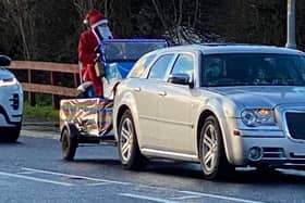 Santa distributing sweets in Skegness on Christmas Day.