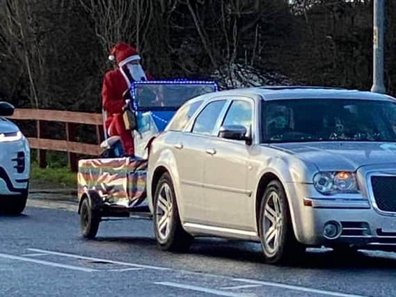 Santa distributing sweets in Skegness on Christmas Day.