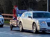 Santa distributing sweets in Skegness on Christmas Day.