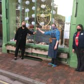 Jen Allmond, Rachel Bell and Keb Betts from Markt Rasen's Tesco store hand the trophy over to Jenny Salvidge