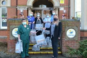 Staff at St Barnabas Hospice received their gift bags from Helene Key, Sales Manager at Chestnut Homes