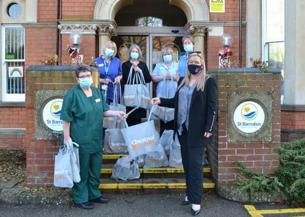Staff at St Barnabas Hospice received their gift bags from Helene Key, Sales Manager at Chestnut Homes