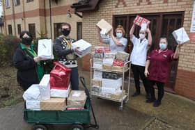 Simon Manning (deputy manager) and Helen Shaw (team leader) handing gifts over to care home staff (from left) Shanice Butterwick, James Black (care assistants), and Sharon Young (senior care assistant).