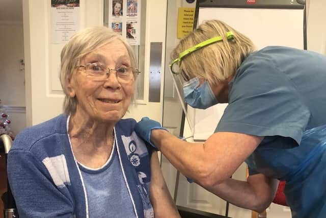 Doreen Teale receives her vaccination.