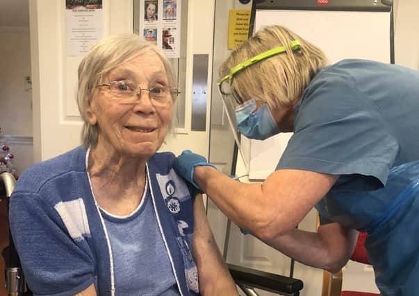 Doreen Teale receives her vaccination.