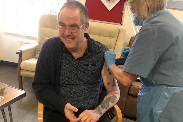 Nigel Perry receives his vaccination