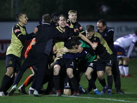 Marine players celebrate winning the match after the final whistle during the Emirates FA Cup Second Round contest against Havant and Waterloovile. Photo: Getty Images