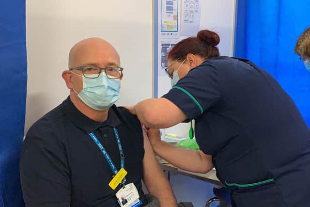 Richard Painter receiving his COVID-19 vaccine