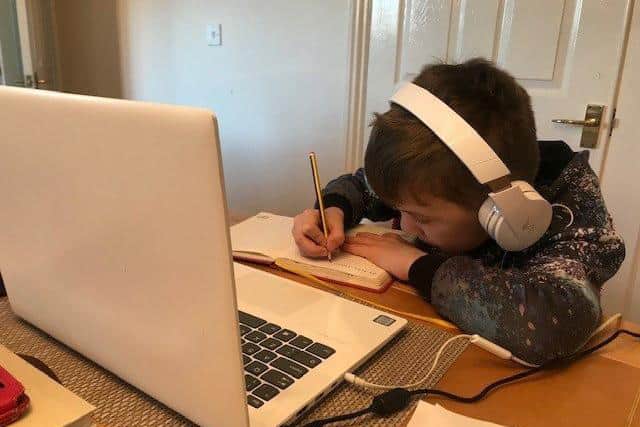 Willliam Alvey pupil working remotely from a laptop. EMN-210901-144801001