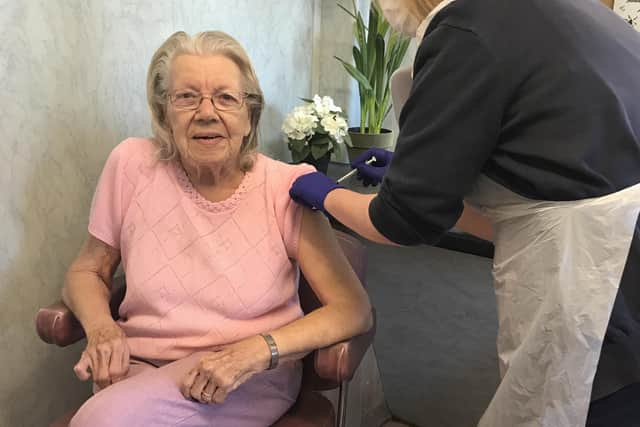 Nancy Preston receiving her jab