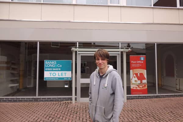 Lee Taylor outside the new premises for Sleaford Post Office and his Pop In Bargains store. EMN-210113-150957001