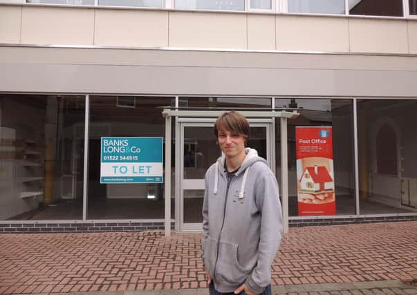 Lee Taylor outside the new premises for Sleaford Post Office and his Pop In Bargains store. EMN-210113-150957001