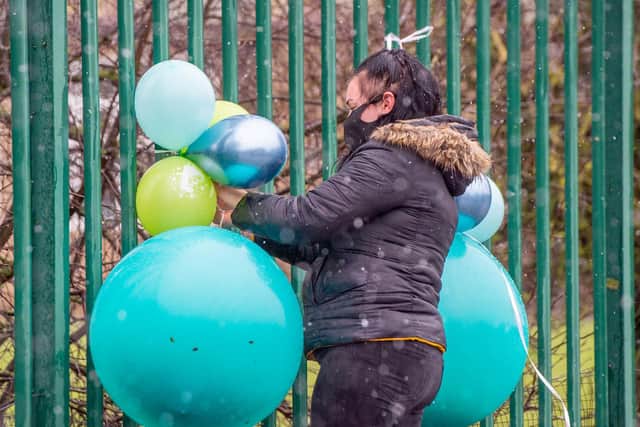 People gathered in the sleet to pay their respects