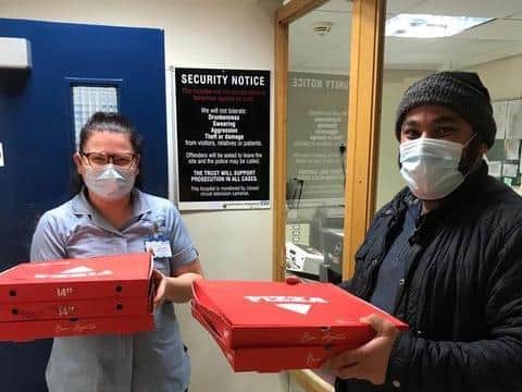 Skegness Hospital staff receiving free meals from Sunny Singh of Downtown Pizza in Ingoldmells