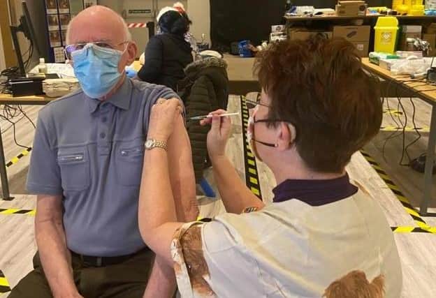 John Sampson, 80, of Skegness, became the first patient in Skegness to receive the Covid-19 vaccine from advanced nurse practitioner Jane Spence, of Orby, who had come out of retirement to help.