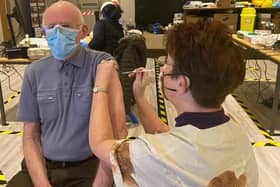 John Sampson, 80, of Skegness, became the first patient in Skegness to receive the Covid-19 vaccine from advanced nurse practitioner Jane Spence, of Orby, who had come out of retirement to help.
