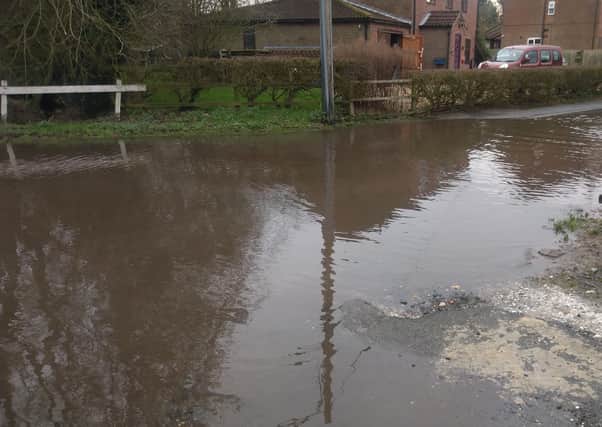 Flooding on Washdyke Lane, which residents say is caused by a blocked drain