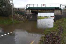Flood water under the railway bridge on Boston Road, Sleaford. EMN-210120-174633001