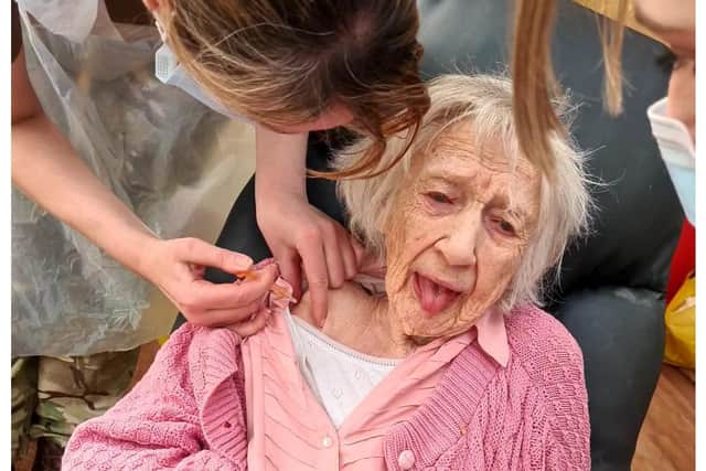 102-year-old Bea Rapley, t of Syne Hills Care Home in Skegness is in the pink after receiving her Covid-19 vaccine.