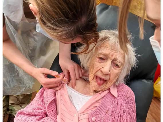 102-year-old Bea Rapley, t of Syne Hills Care Home in Skegness  is in the pink after receiving her Covid-19 vaccine.