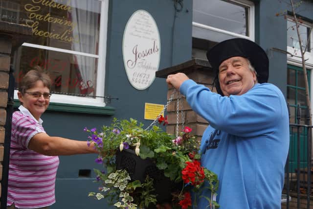 Peter Harrold delivering the hanging baskets to businesses in the town last year - and he will be leading the project to get Rasen blooming even bigger this year EMN-210126-111716001