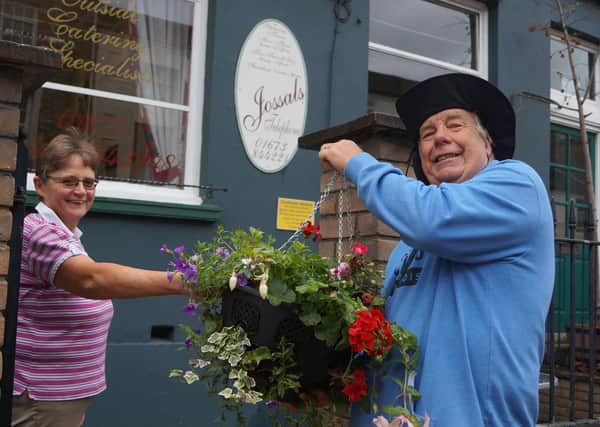 Peter Harrold delivering the hanging baskets to businesses in the town last year - and he will be leading the project to get Rasen blooming even bigger this year EMN-210126-111716001