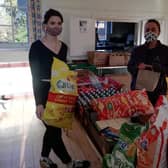 Big thanks:  Horncastle ChEF’s Jess Holland (left)  accepts  donations from  the Co-op.