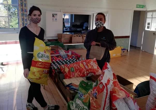 Big thanks: Horncastle ChEF’s Jess Holland (left) accepts donations from the Co-op.