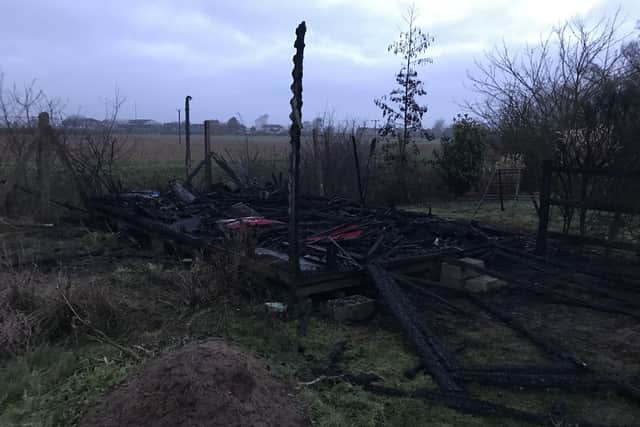 Razed to the ground. Twisted metal is all that remains of the equipment shed at Billinghay Primary School after the arson incident overnight. EMN-210127-153857001