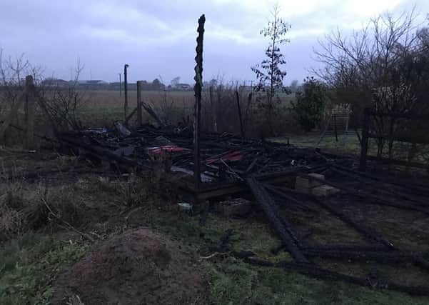 Razed to the ground. Twisted metal is all that remains of the equipment shed at Billinghay Primary School after the arson incident overnight. EMN-210127-153857001