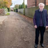 County Councillor Bill Aron at the  section of Holt Lane  which is at the centre of calls for an upgrade