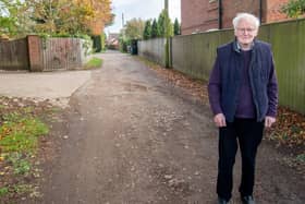 County Councillor Bill Aron at the  section of Holt Lane  which is at the centre of calls for an upgrade