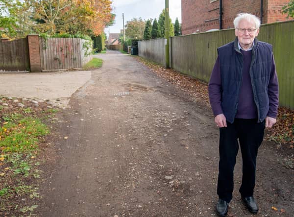 County Councillor Bill Aron at the  section of Holt Lane  which is at the centre of calls for an upgrade