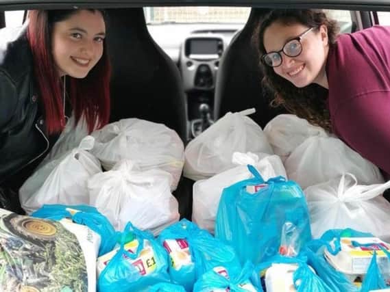 Volunteers Megan, 26 and Grace Cox, 21, have been delivering free meals to homeschoolers.