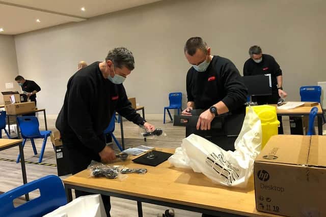 Skegness Firefighters helping to set up the Covid-19 vaccination centre at the Storehouse in Skegness.;