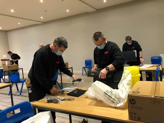 Skegness Firefighters helping to set up the Covid-19 vaccination centre at the Storehouse in Skegness.;