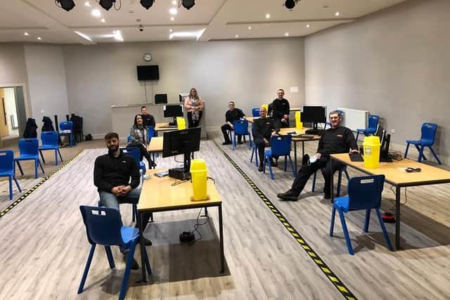 Job well done. Skegness Firefighters take a break after setting  up the Covid-19 vaccination centre at the Storehouse in Skegness.;