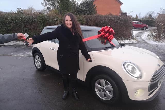 Joanne Roper with her Mini new One 1.5 Classic worth £19k which she won in a competition run for .Huawei AppGallery users.