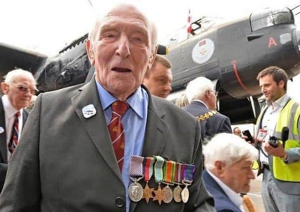 George ‘Johnny’ Johnson on familiar ground -  in front of a Lancaster bomber at RAF Coningsby