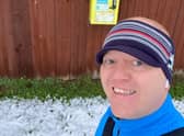 Jamie Aspland, branch manager at Pygott & Crone, in Sleaford, during the #BHF100K, promoting the location of a defibrillator as part of a social media effort.
