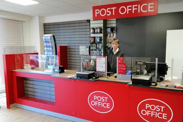 Postmaster Lee Taylor behind the counter of his new post office premises in Sleaford's Southgate Precinct. EMN-211202-170610001