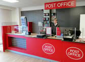 Postmaster Lee Taylor behind the counter of his new post office premises in Sleaford's Southgate Precinct. EMN-211202-170610001